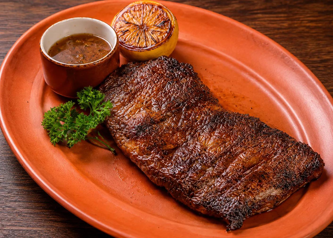 Popular item de Latin on Ocean Drive: BRAISED FLANK STEAK